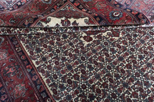 Corner detail of 1970s Bijar rug showing border pattern and Wool pile