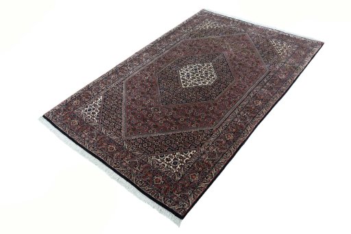 Corner detail of New Bijar rug showing border pattern and Cork pile