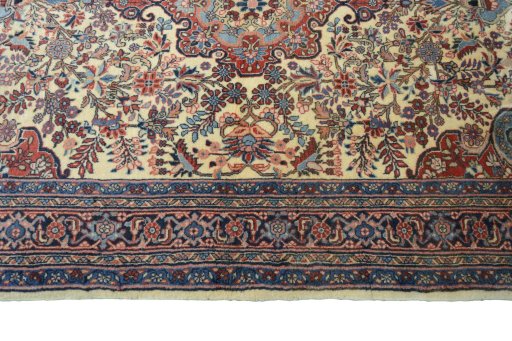 Corner detail of 2000s Bijar rug showing border pattern and Wool pile