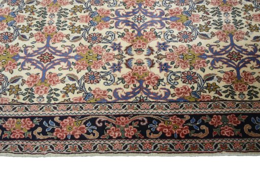 Corner detail of 2000s Bijar rug showing border pattern and Wool pile