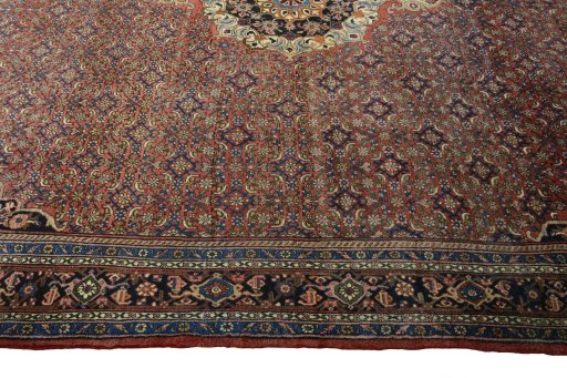 Corner detail of 1970s Bijar rug showing border pattern and Cork pile