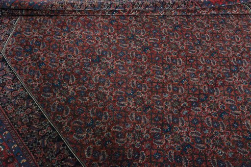 Corner detail of 1930s Bijar rug showing border pattern and Wool pile