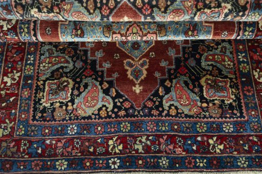 Corner detail of 1930s Bijar rug showing border pattern and Wool pile