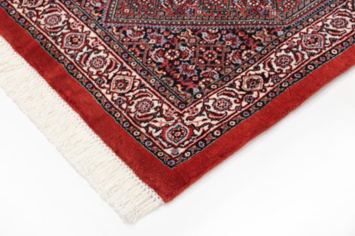 Backside of handmade New Bijar rug showing knot structure and weave density