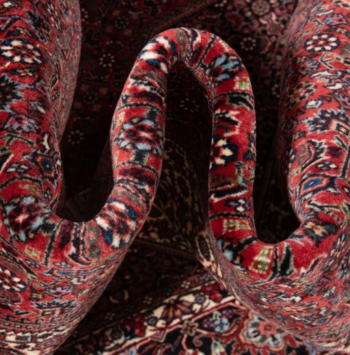 Backside of handmade New Bijar rug showing knot structure and weave density