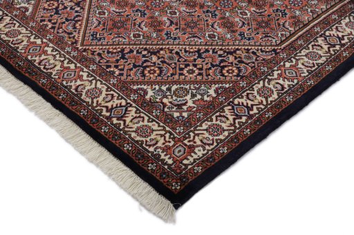 Backside of handmade New Bijar rug showing knot structure and weave density