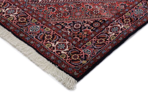 Backside of handmade New Bijar rug showing knot structure and weave density