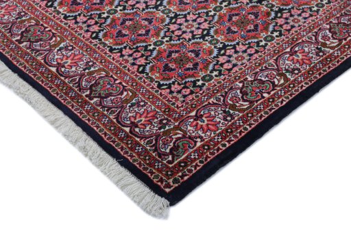 Backside of handmade New Bijar rug showing knot structure and weave density