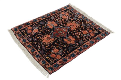 Corner detail of 1920s Bijar rug showing border pattern and Wool pile
