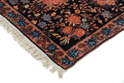 Backside of handmade 1920s Bijar rug showing knot structure and weave density