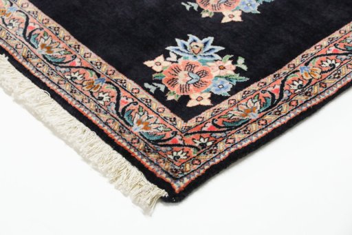Backside of handmade New Bijar rug showing knot structure and weave density