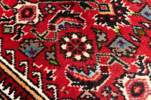 Surface texture of 2020s Bijar rug with natural Wool and intricate pattern