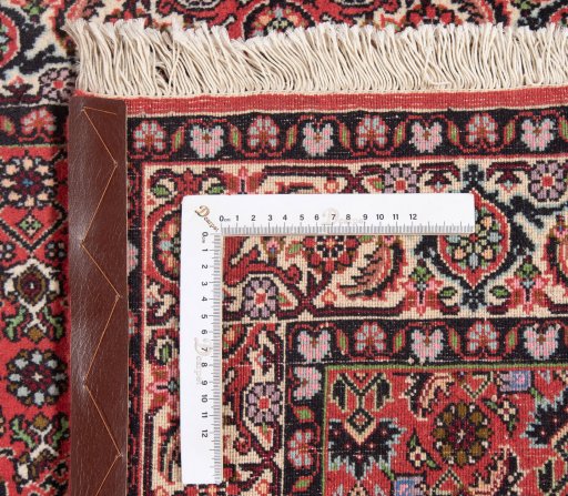 Backside of handmade New Bijar rug showing knot structure and weave density