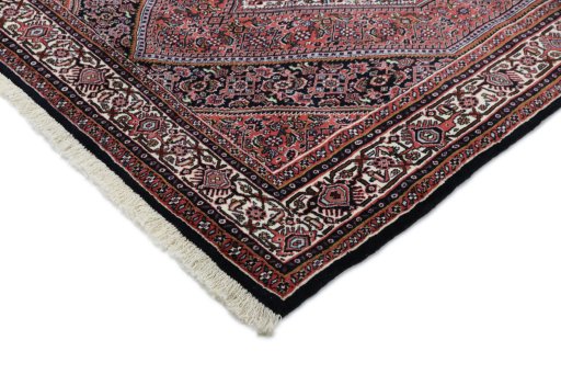 Backside of handmade New Bijar rug showing knot structure and weave density