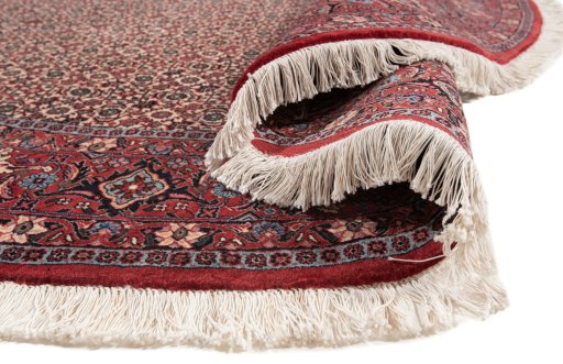 Backside of handmade New Bijar rug showing knot structure and weave density