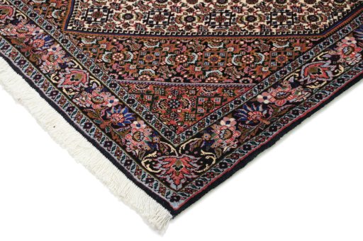 Backside of handmade New Bijar rug showing knot structure and weave density