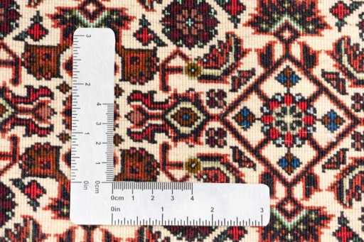 Backside of handmade New Bijar rug showing knot structure and weave density