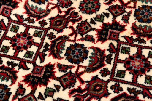 Backside of handmade New Bijar rug showing knot structure and weave density