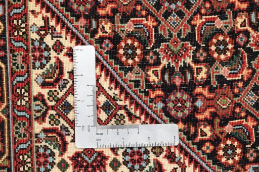 Backside of handmade New Bijar rug showing knot structure and weave density