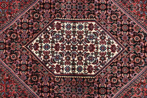 Backside of handmade New Bijar rug showing knot structure and weave density