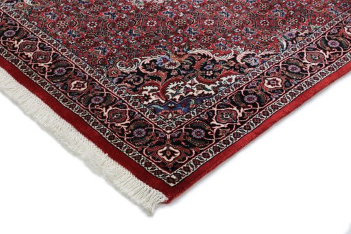 Backside of handmade New Bijar rug showing knot structure and weave density
