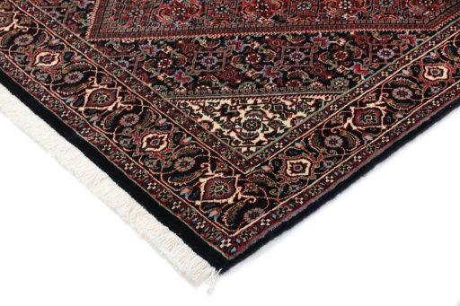Backside of handmade New Bijar rug showing knot structure and weave density