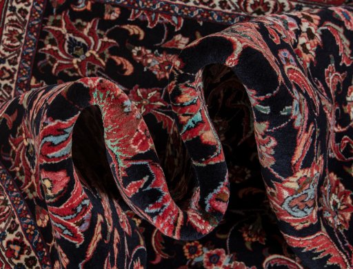 Backside of handmade New Bijar rug showing knot structure and weave density