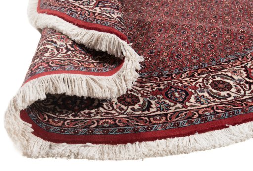 Backside of handmade New Bijar rug showing knot structure and weave density