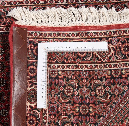 Backside of handmade New Bijar rug showing knot structure and weave density