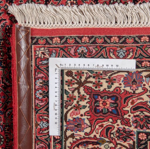 Backside of handmade New Bijar rug showing knot structure and weave density