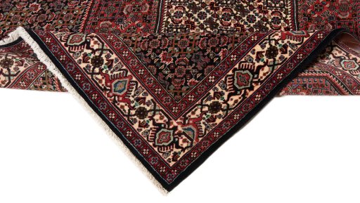 Corner detail of 1990s Bijar rug showing border pattern and Wool pile