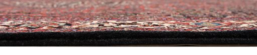 Corner detail of 1990s Bijar rug showing border pattern and Wool pile