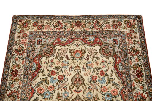 Surface texture of 1960s Ghom rug with natural Wool and intricate pattern