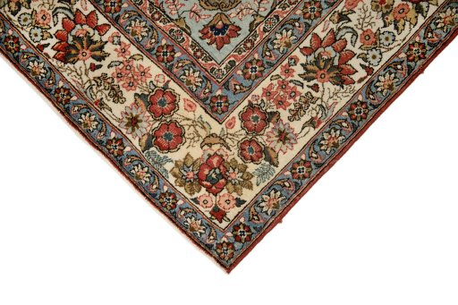 Backside of handmade 1960s Ghom rug showing knot structure and weave density