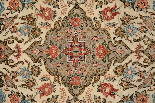 Central medallion detail of 1960s Ghom rug from Iran / Persia