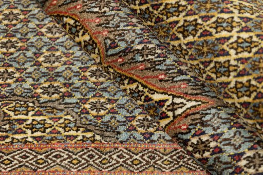 Corner detail of 1960s Ghom rug showing border pattern and Wool pile