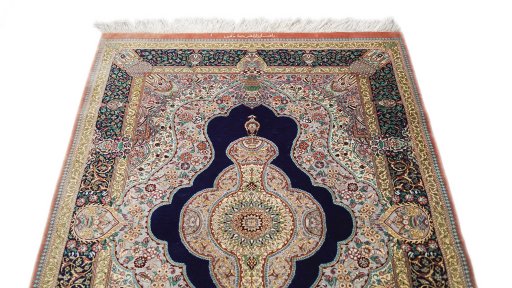 Surface texture of New Ghom rug with natural Silk and intricate pattern