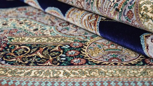 Close-up detail of New Ghom rug from Iran / Persia showing Silk weave