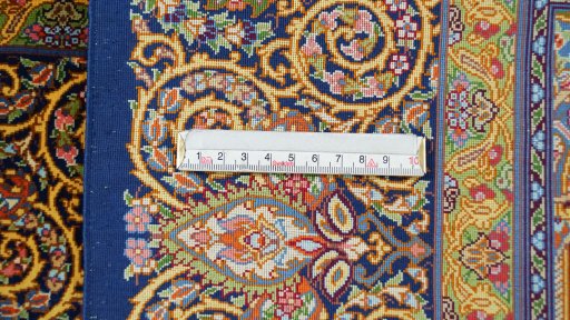 Corner detail of New Ghom rug showing border pattern and Silk pile