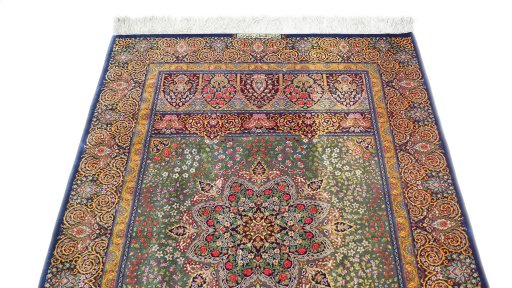 Surface texture of New Ghom rug with natural Silk and intricate pattern