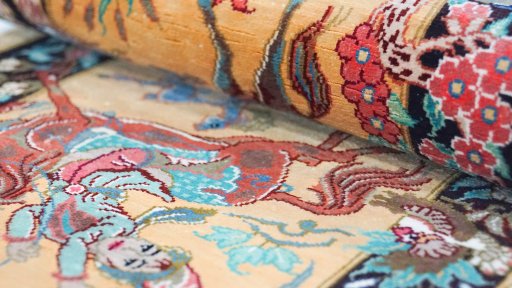 Close-up detail of New Ghom rug from Iran / Persia showing Silk weave