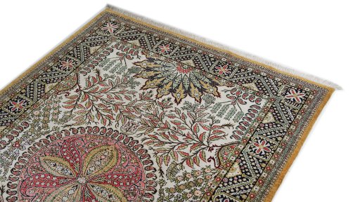 Surface texture of 1970s Ghom rug with natural Wool and intricate pattern