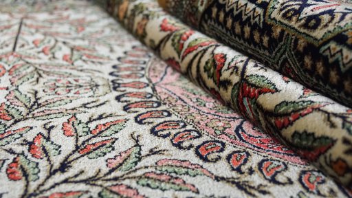 Close-up detail of 1970s Ghom rug from Iran / Persia showing Wool weave
