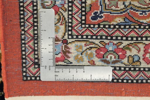 Close-up detail of 1990s Ghom rug from Iran / Persia showing Wool weave