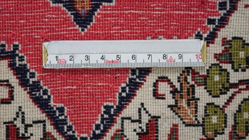 Backside of handmade 1990s Ghom rug showing knot structure and weave density