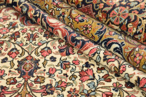 Close-up detail of 1980s Ghom rug from Iran / Persia showing Wool weave