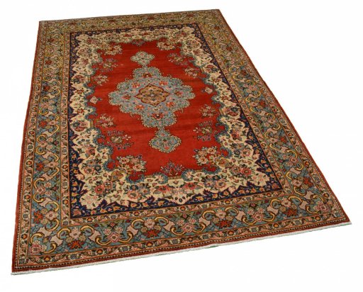 Corner detail of 1950s Ghom rug showing border pattern and Cork pile