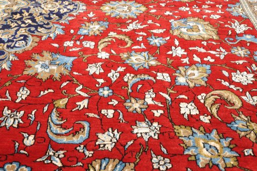 Backside of handmade 1970s Ghom rug showing knot structure and weave density