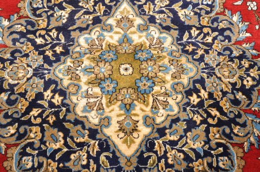 Corner detail of 1970s Ghom rug showing border pattern and Wool pile