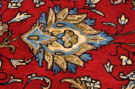 Surface texture of 1970s Ghom rug with natural Wool and intricate pattern